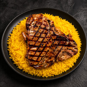 strip steak over rice